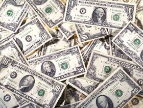 Oil price down as storage billows and dollar strengthens