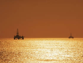 Oil down, but supported by vaccine optimism