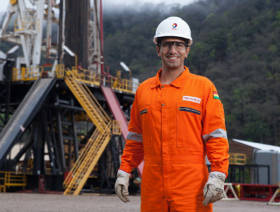 Total raises profit, sees revenue slip