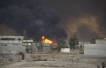 Iraq extinguishes burning oil wells