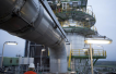 Crude prices slip lower with U.S. stockpile data on tap