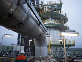 Crude prices slip lower with U.S. stockpile data on tap