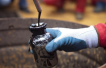 Oil prices waver ahead of US data