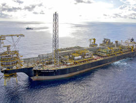 Oil down on stronger dollar, weak US economic data