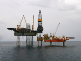 Oil up despite OPEC production cut squabble