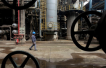 Oil prices slip on EIA report but rebound