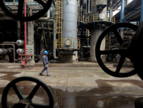 Oil prices slip on EIA report but rebound